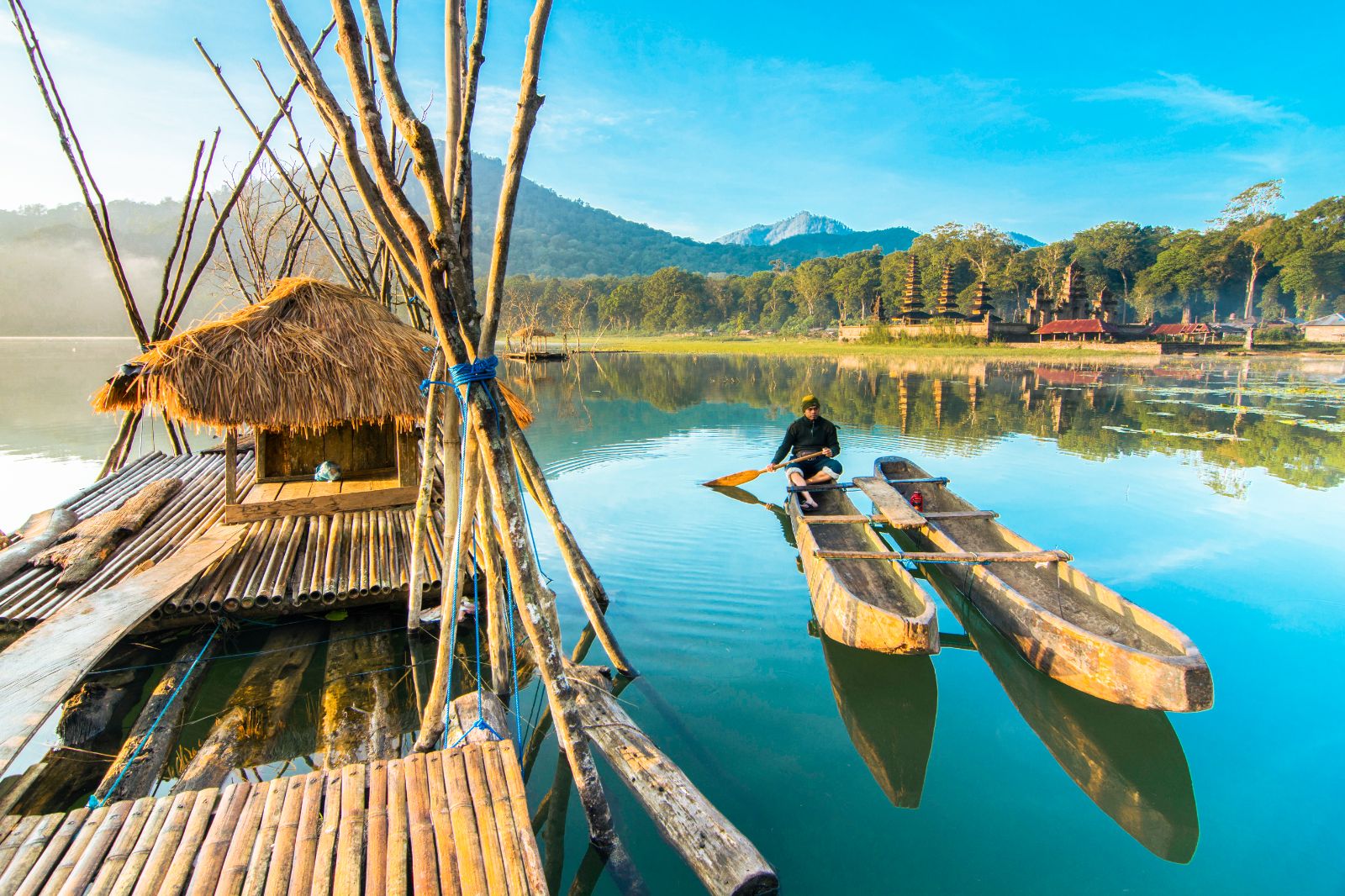 Traditional boats on the waters of Lake Tamblingan in Indonesia