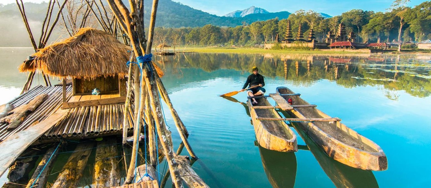 Traditional boats on the waters of Lake Tamblingan in Indonesia