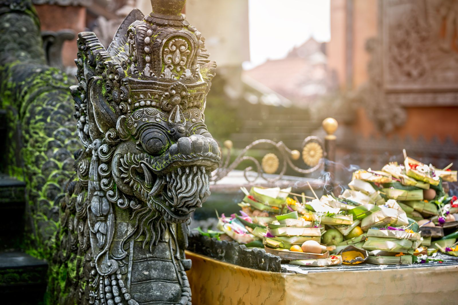 Intricate stone carving of a dragon on a temple in Ubud, Bali