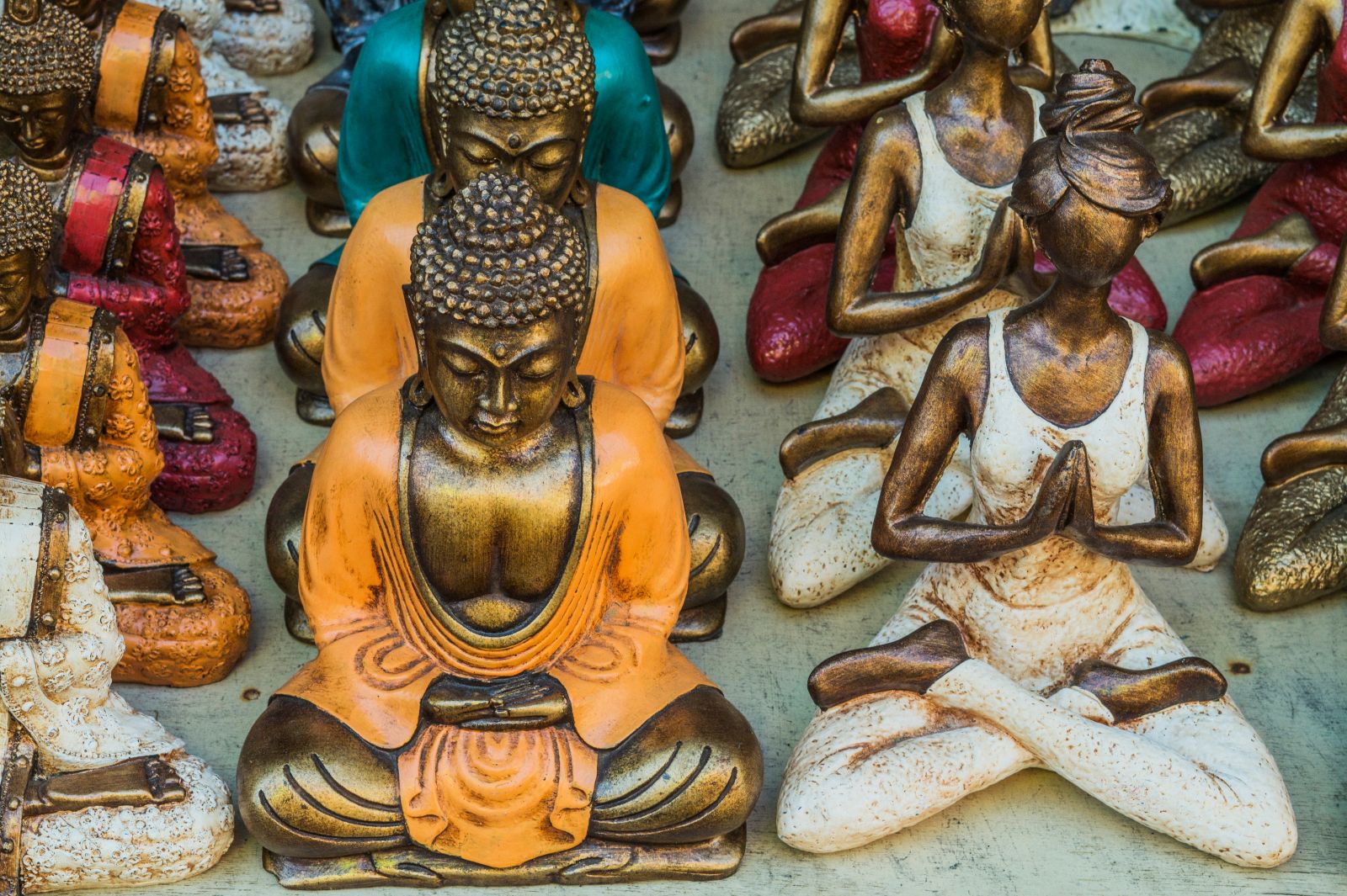 Colourful souvenirs of buddhas and yogis in Ubud, Indonesia