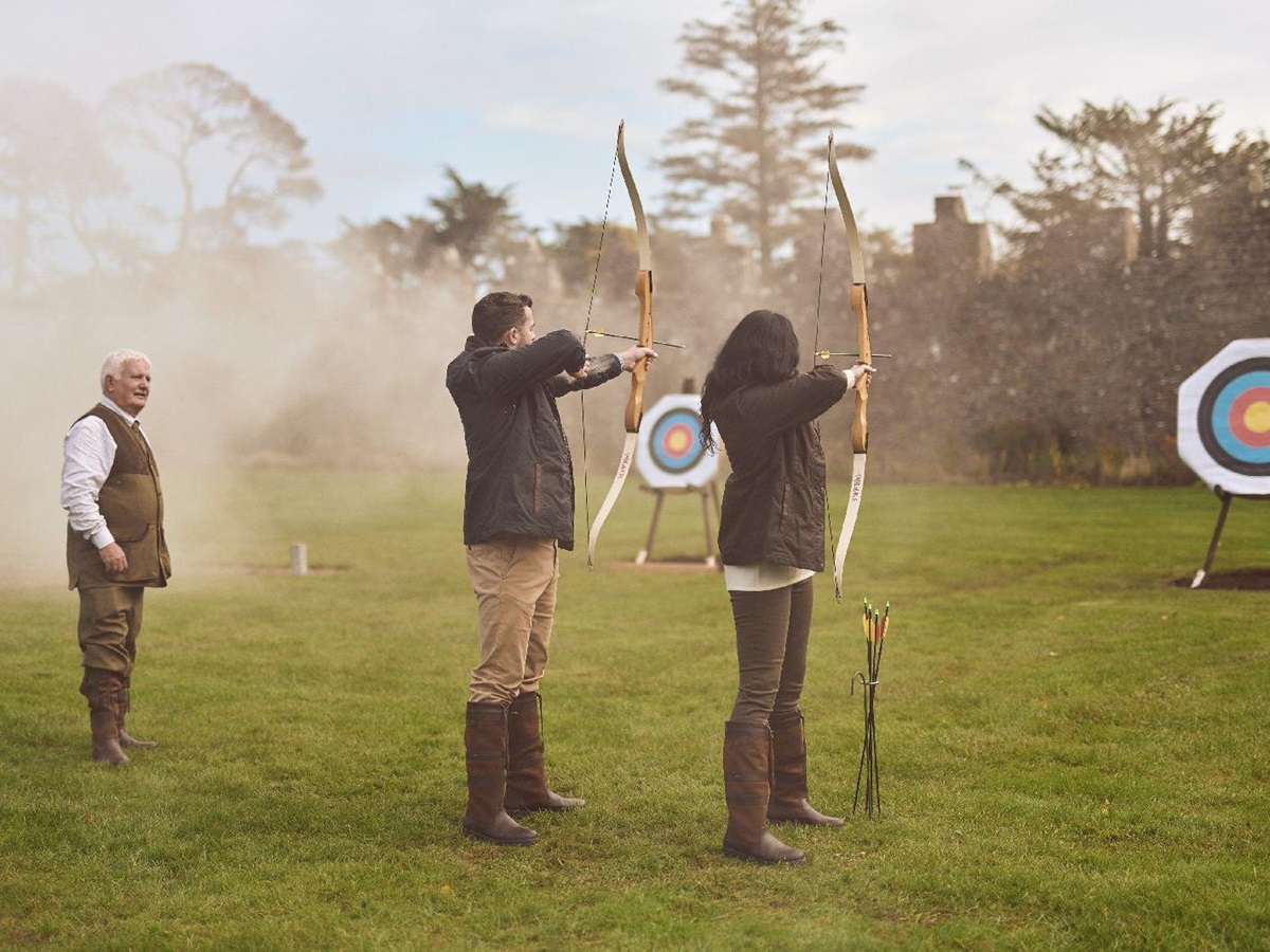 Guests practicing archery at Adare Manor near Limerick in Ireland