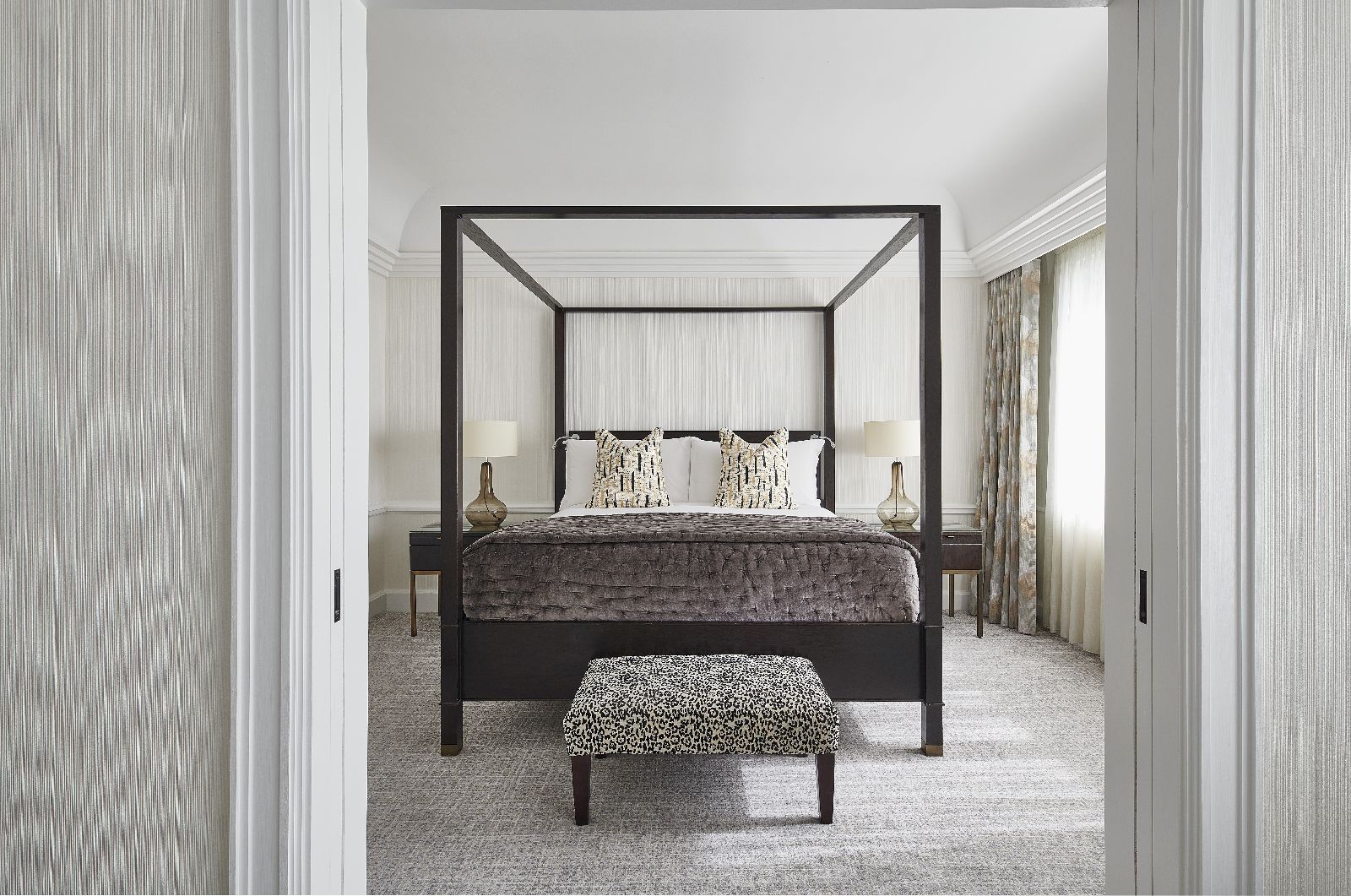 Stylish guest room with four poster bed at The Westbury hotel in Dublin Ireland