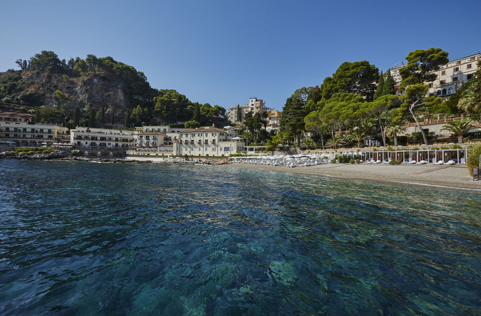 Hotel exterior and beach at Belmond Villa Sant'Andrea in Sicily