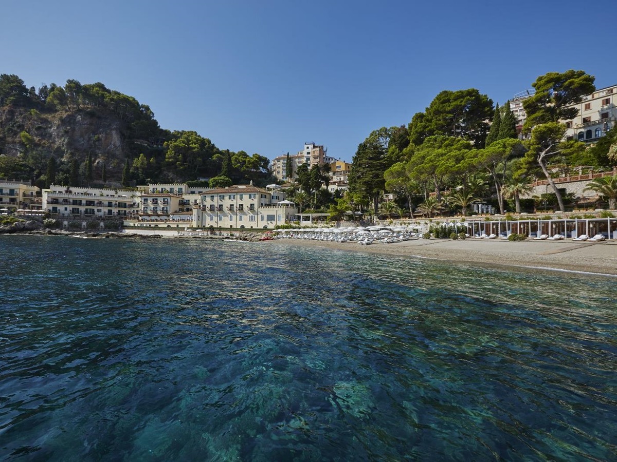 Hotel exterior and beach at Belmond Villa Sant'Andrea in Sicily