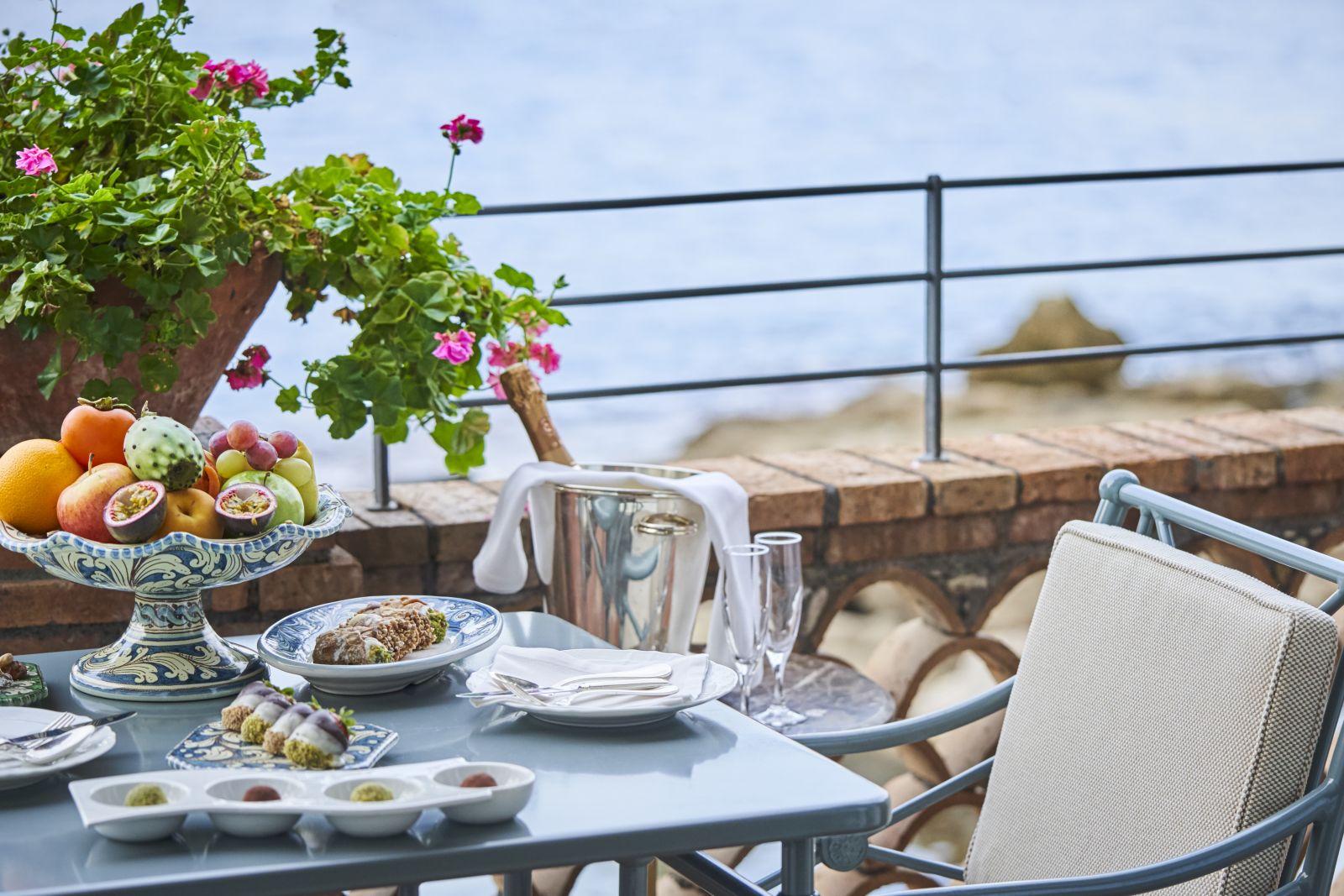 Dining on the terrace at Belmond Villa Sant'Andrea in Sicily