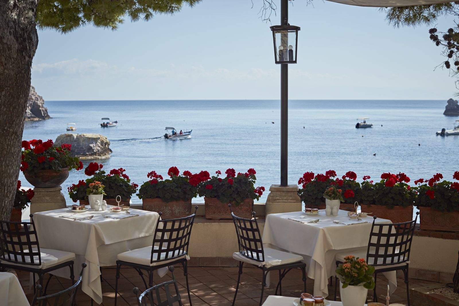 Bay views from the restaurant terrace at Belmond Villa Sant'Andrea in Sicily
