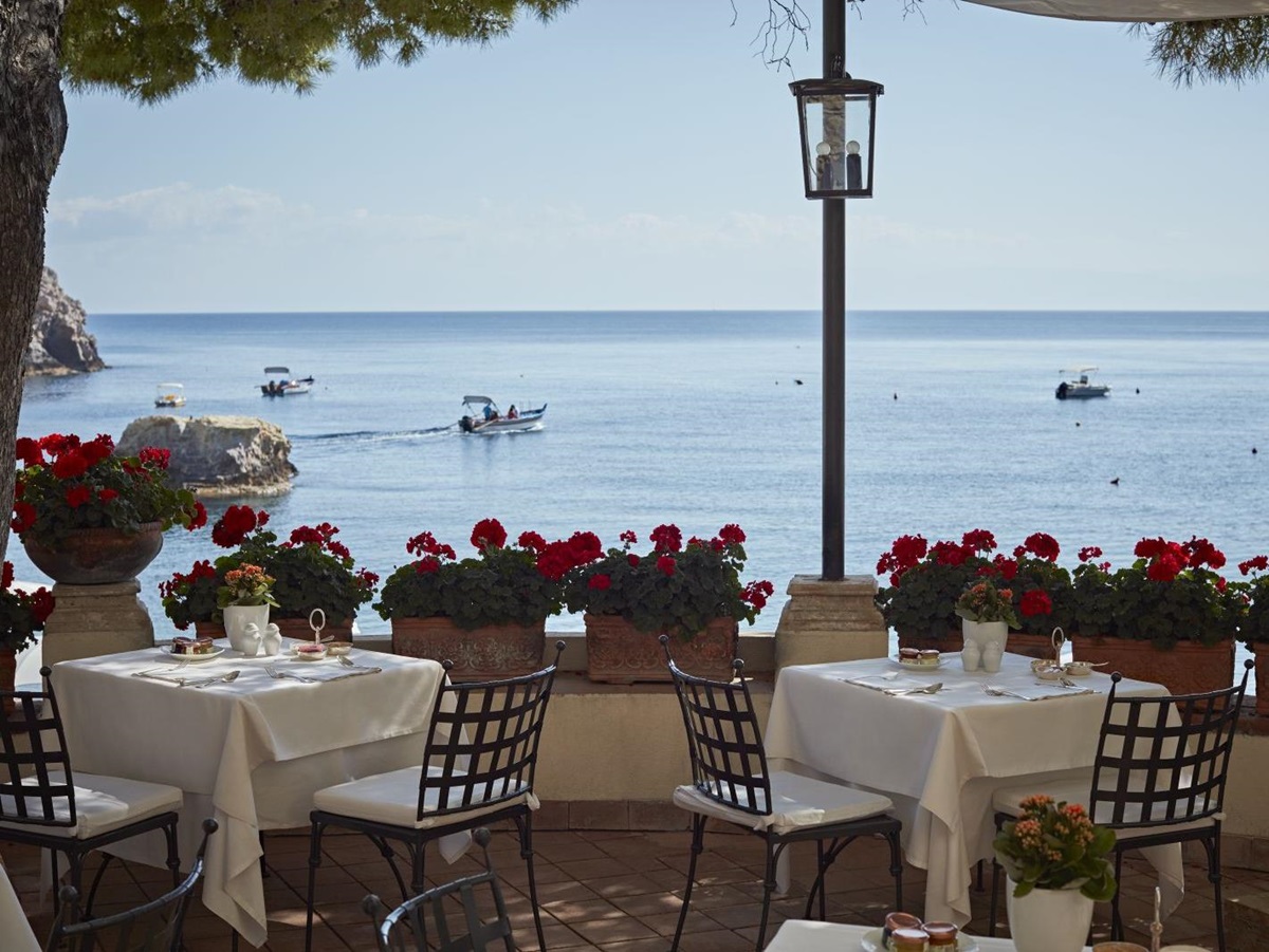 Bay views from the restaurant terrace at Belmond Villa Sant'Andrea in Sicily