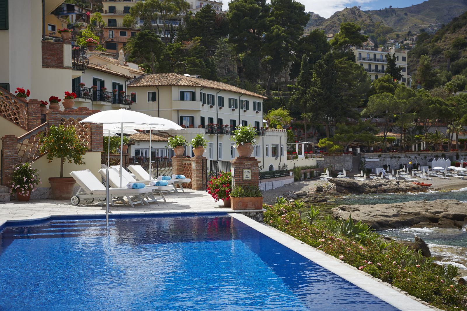 Outdoor swimming pool at Belmond Villa Sant'Andrea in Sicily