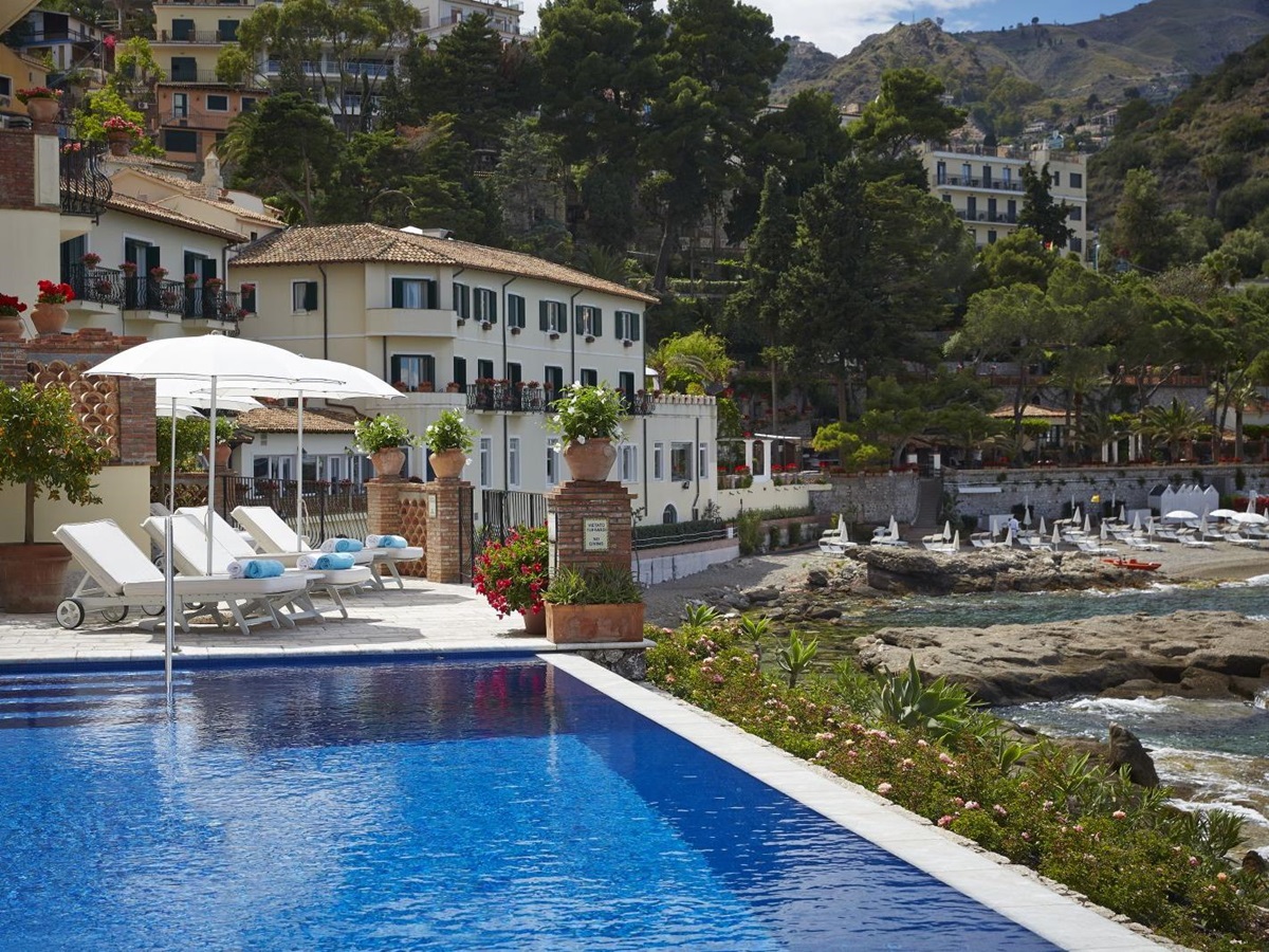 Outdoor swimming pool at Belmond Villa Sant'Andrea in Sicily