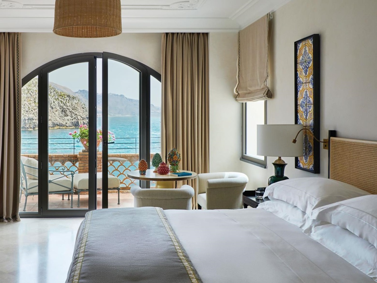 Guest room with balcony at Belmond Villa Sant'Andrea in Sicily