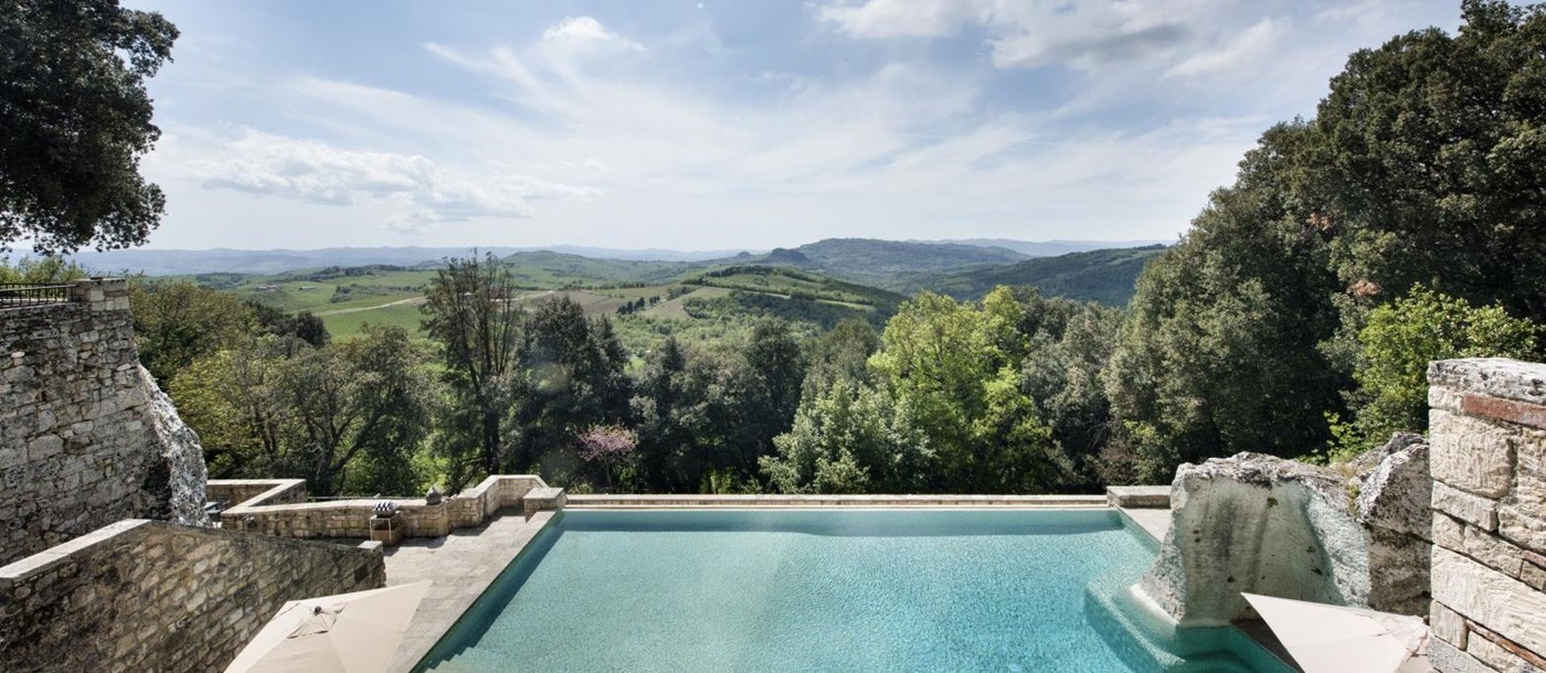 Swimming pool and views at the Borgo Pignano in Tuscany