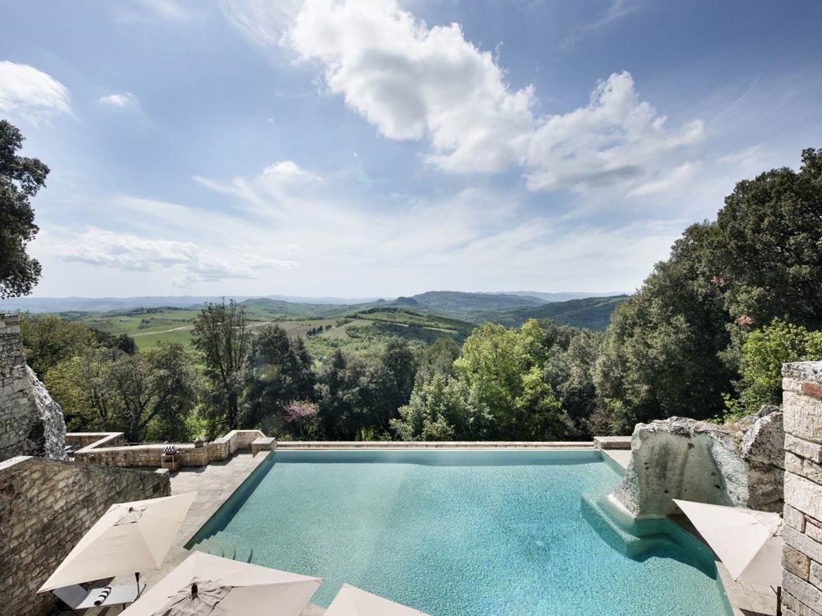 Swimming pool and views at the Borgo Pignano in Tuscany