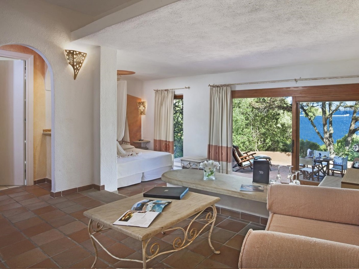 Junior Suite with sitting are aand private terrace with sea views at luxury hotel Capo d'Orso on Sardinia, Italy