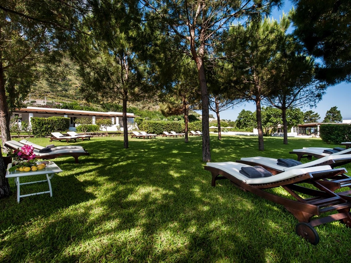 Lawn and loungers at Capofaro