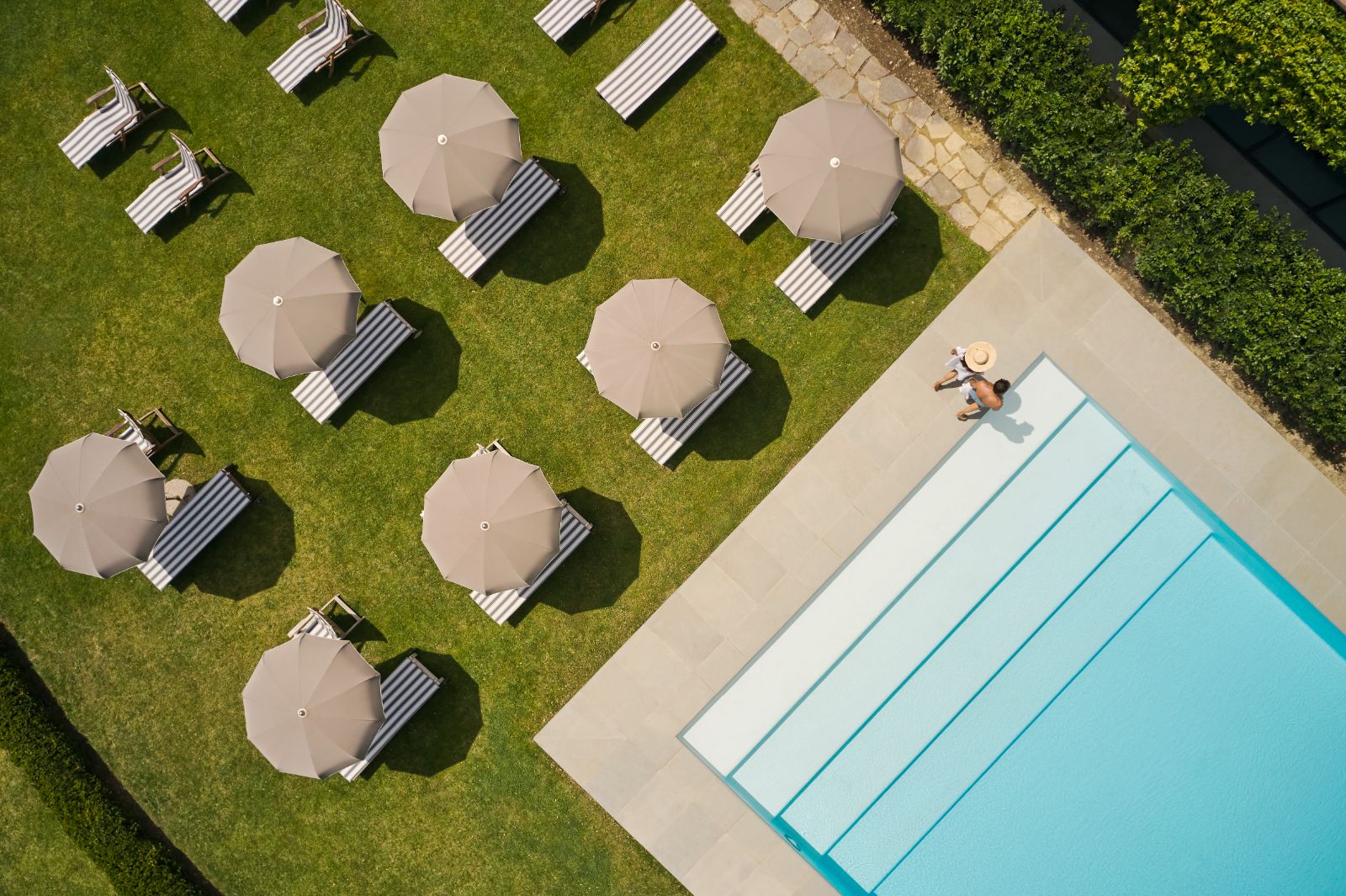 Luxury Hotel COMO Castello del Nero Aerial View of Swimming Pool with Poolside Loungers