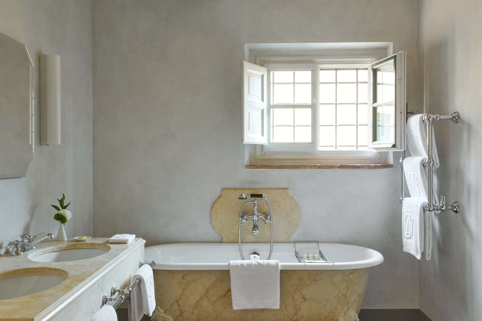 Marble bathroom of an estate at luxury resort COMO Castello del Nero in Italy