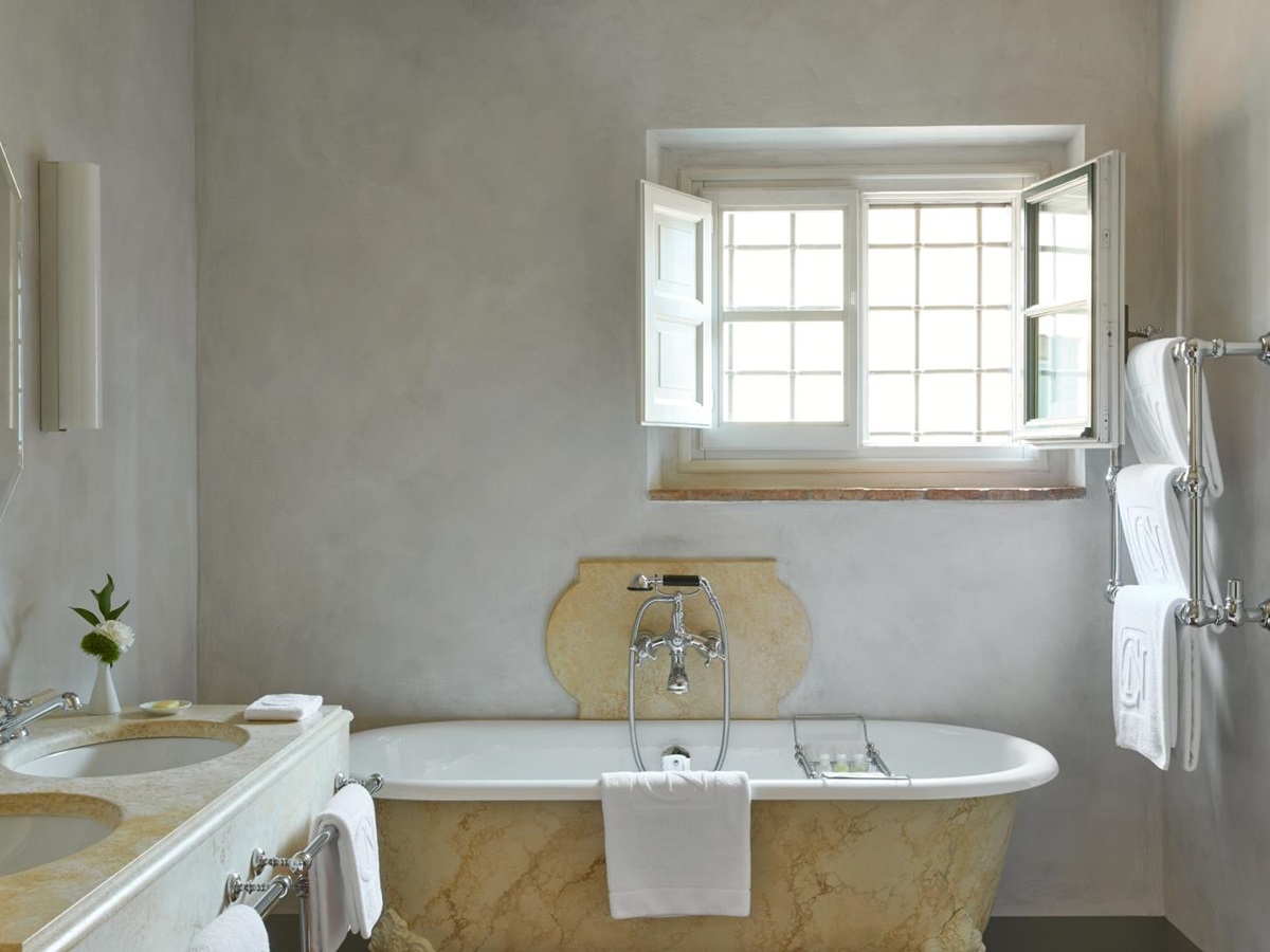Marble bathroom of an estate at luxury resort COMO Castello del Nero in Italy