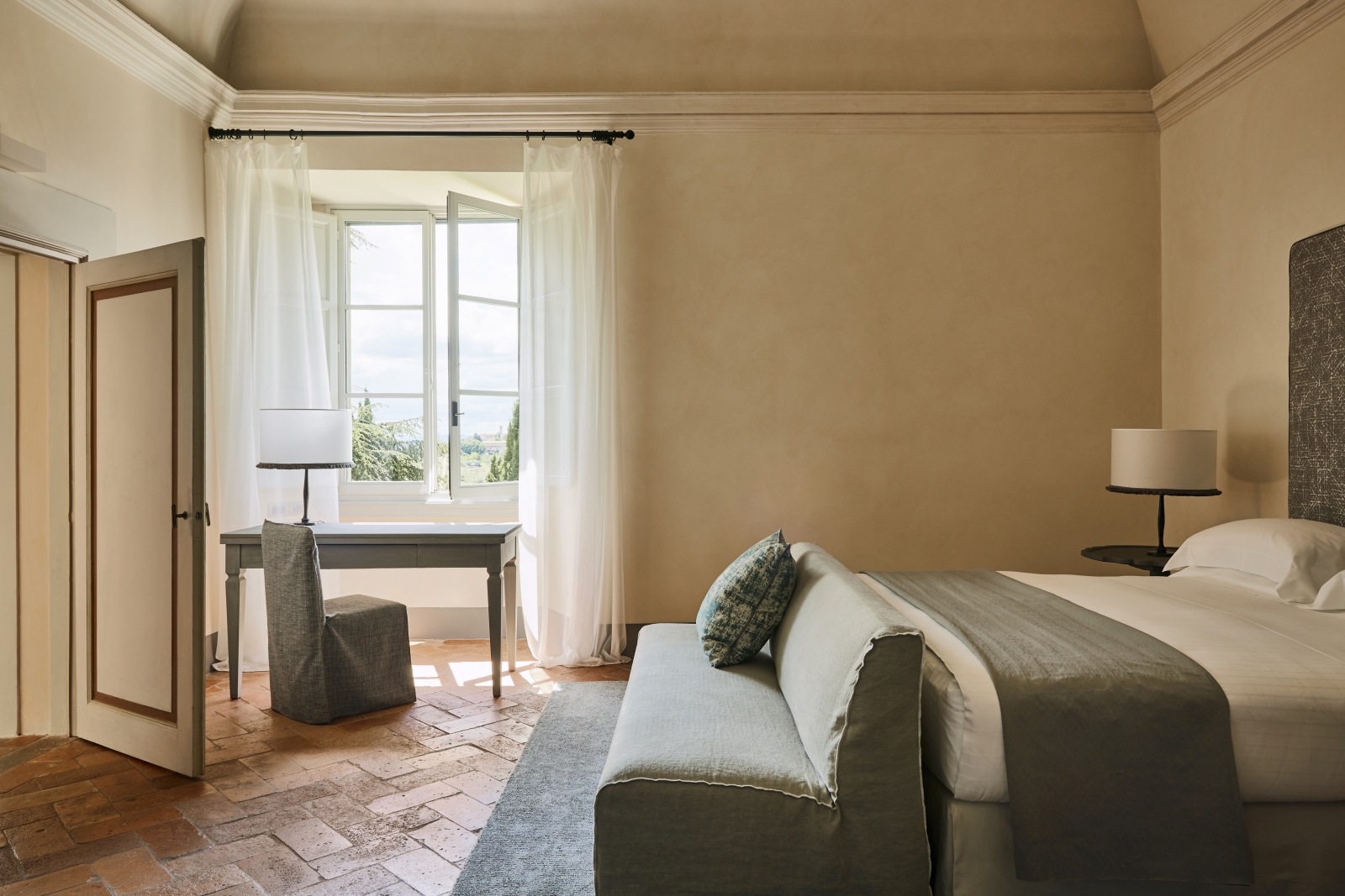 Minimalist Heritage Suite bedroom at luxury resort COMO Castello del Nero in Italy