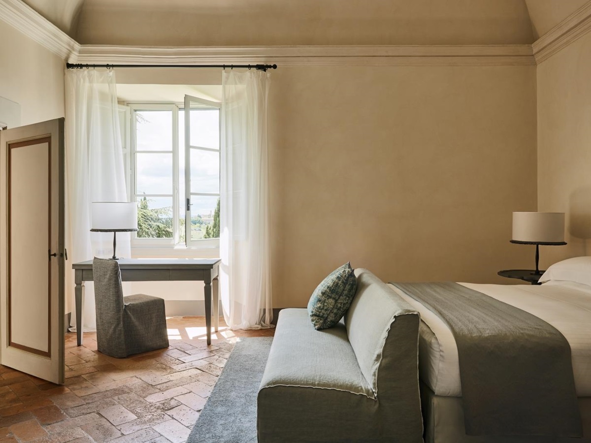 Minimalist Heritage Suite bedroom at luxury resort COMO Castello del Nero in Italy