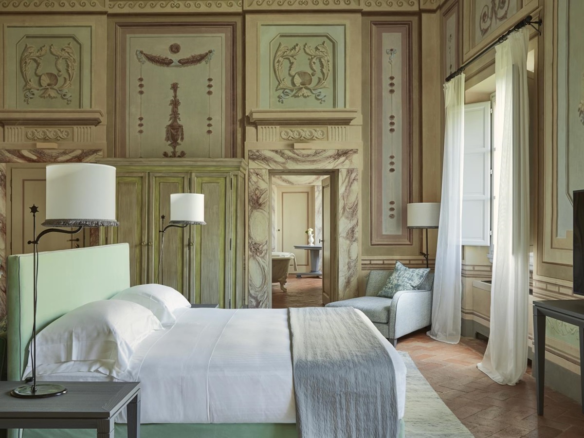 Bedroom of a Heritage Suite at luxury resort COMO Castello del Nero in Italy