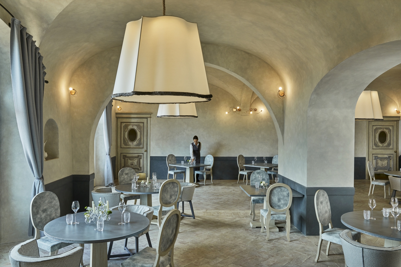 Dining area of La Torre restaurant at luxury resort COMO Castello del Nero in Italy