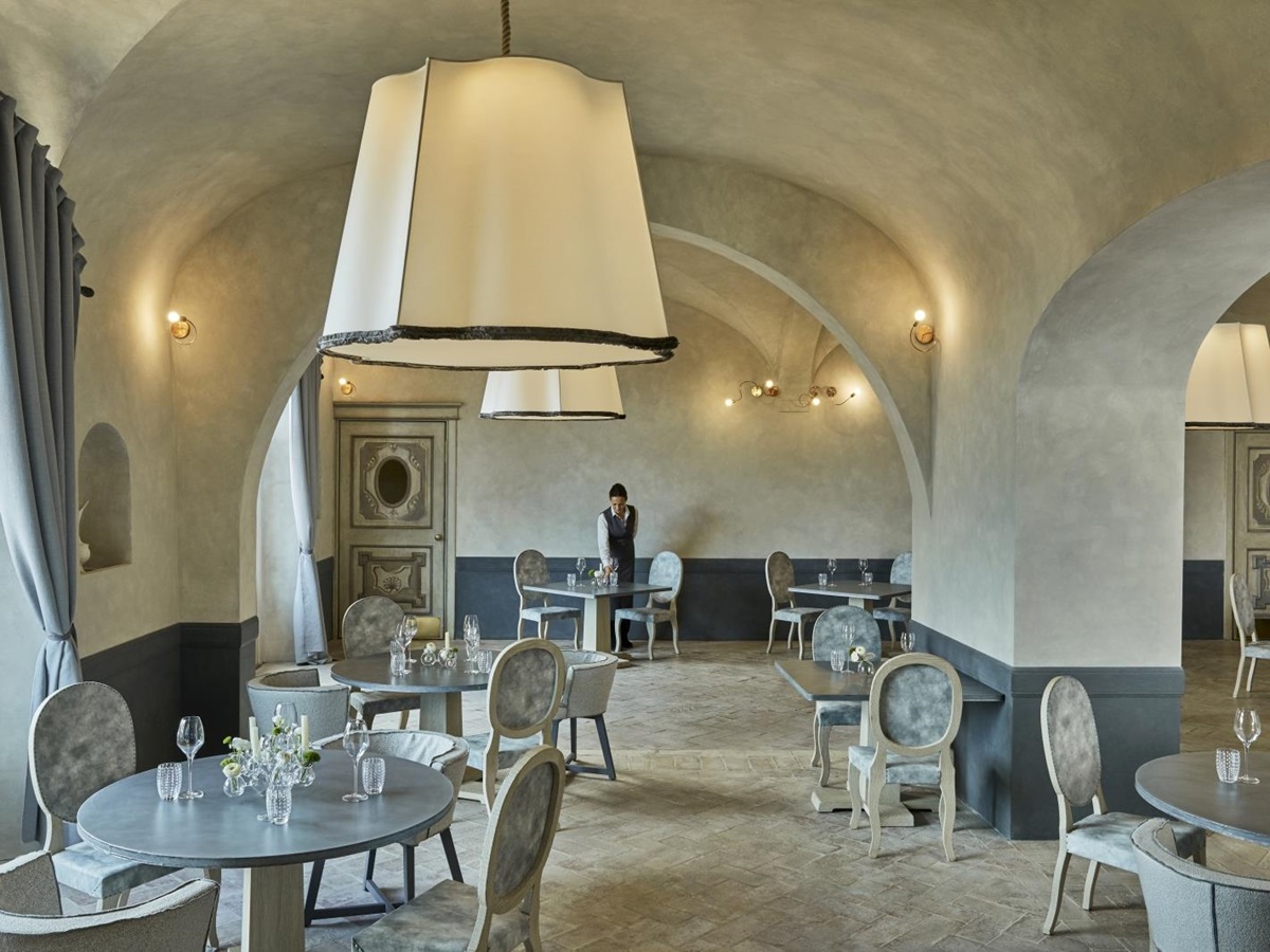 Dining area of La Torre restaurant at luxury resort COMO Castello del Nero in Italy