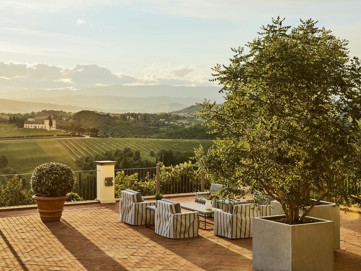 Panoramic Terrace and views over the country side at sunset at luxury resort COMO Castello del Nero in Italy