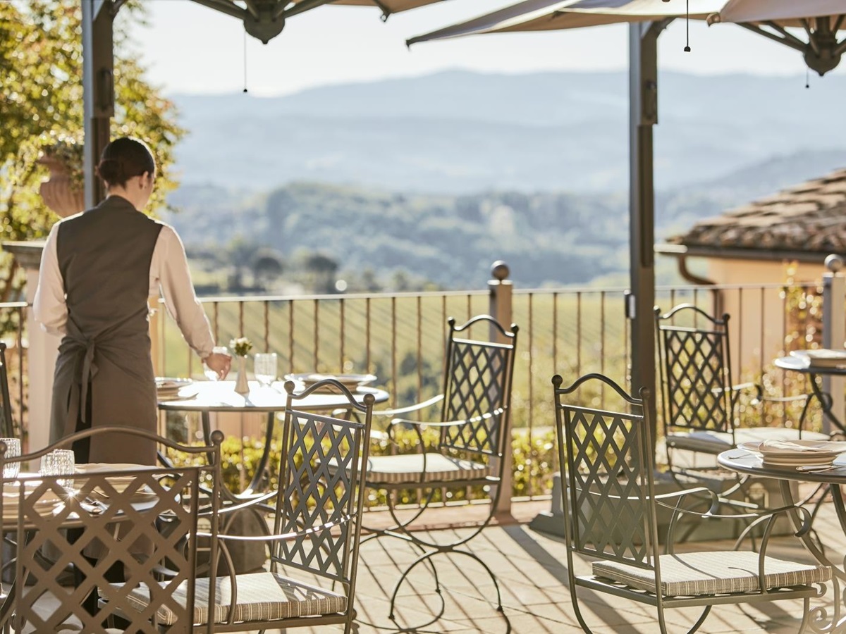 Dining on the panoramic terrace at luxury resort COMO Castello del Nero in Italy