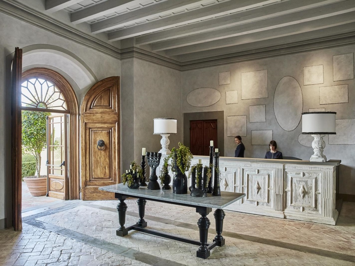 Reception with art at luxury resort COMO Castello del Nero in Italy