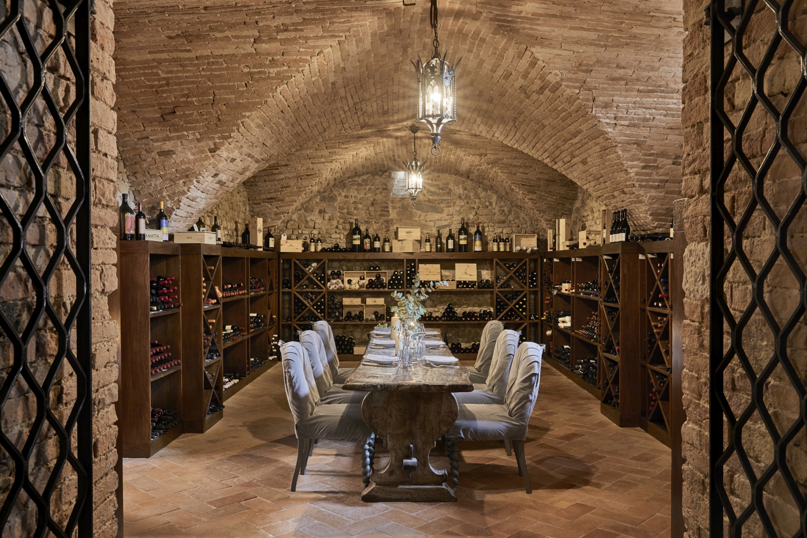 Private dining in the wine cellar of luxury resort COMO Castello del Nero in Italy