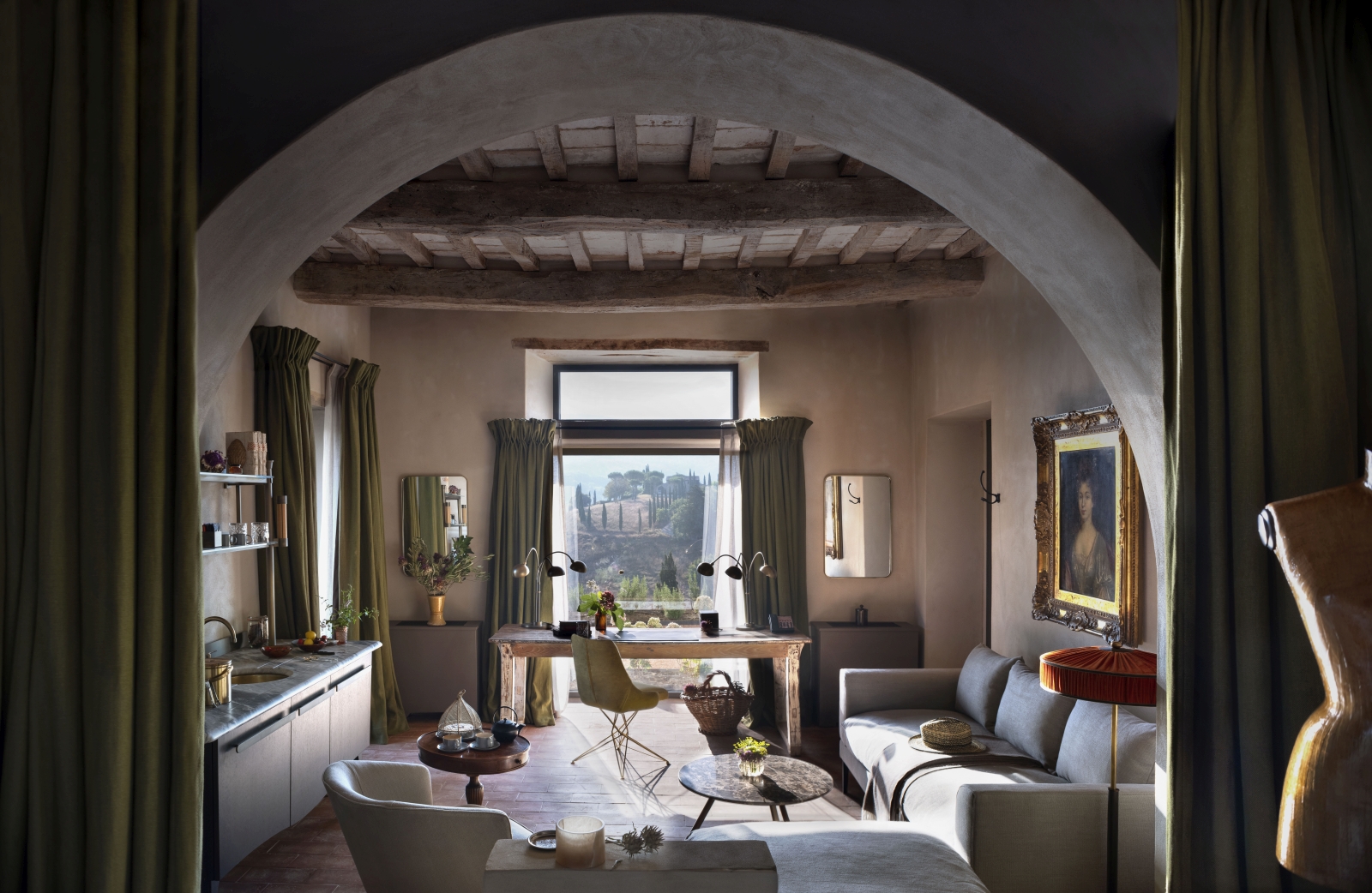 Lounge and office space in a suite at luxury hotel Castello di Reschio in Umbria, Italy, with views over the Umbrian landscape
