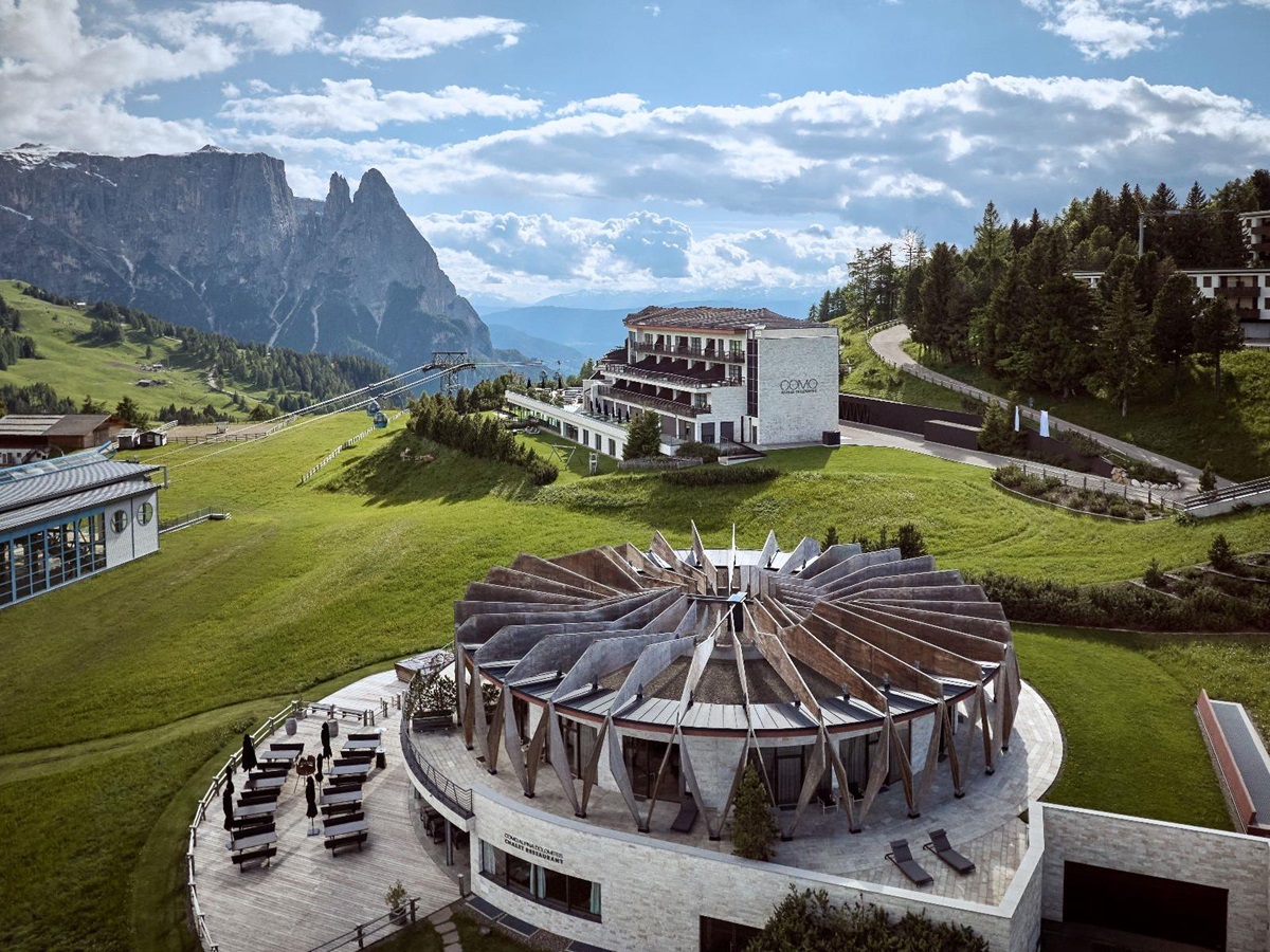 Exterior view of COMO Alpina Dolomites during the summer