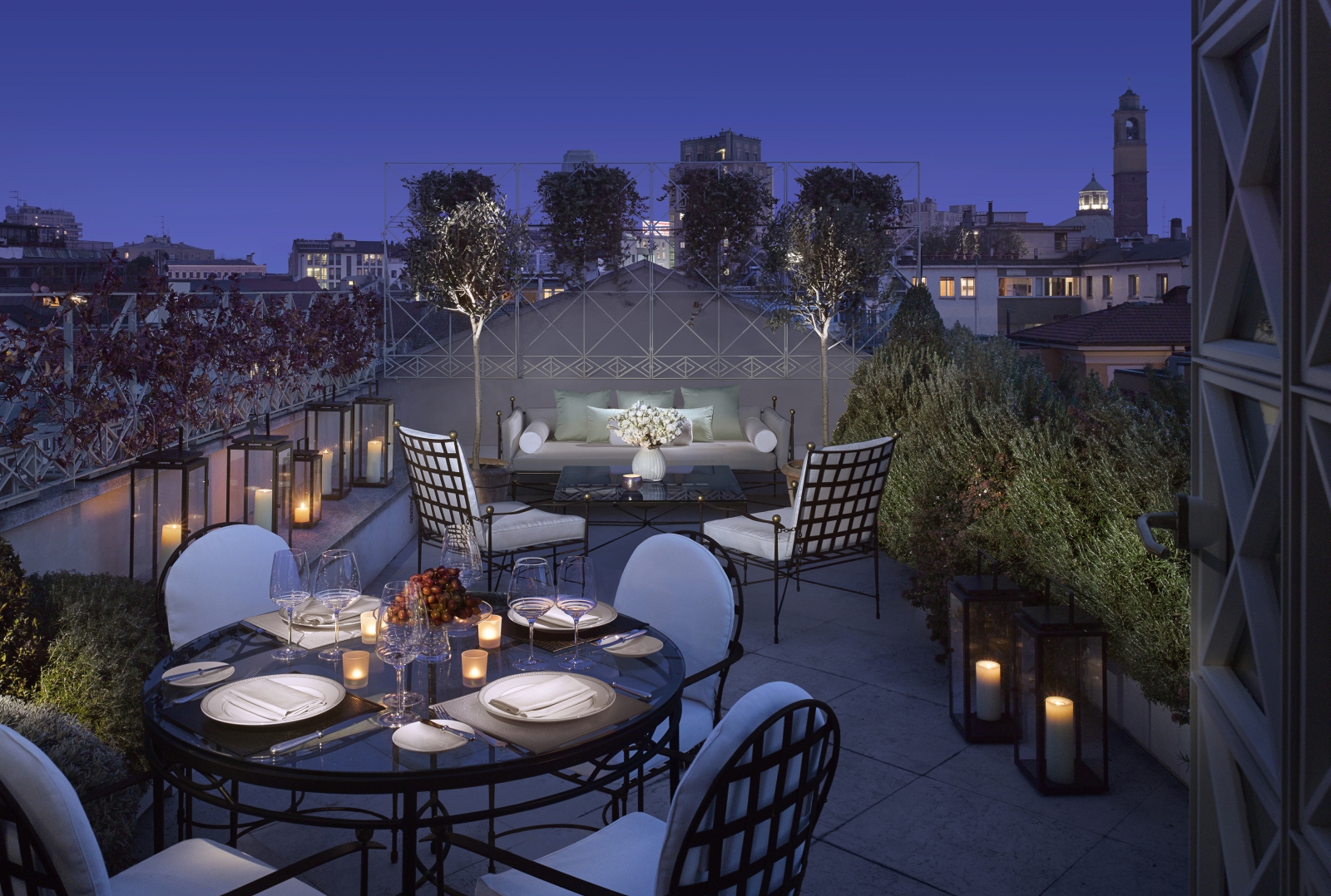 the balcony of the Penthouse Suite set up for a private dinner
