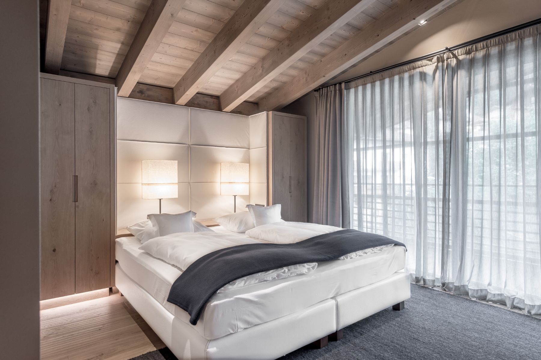 Attico Suite bedroom at Gardena Grodnerhof Hotel & Spa in the Dolomites