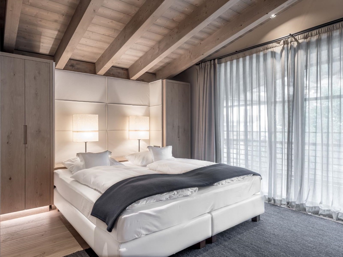 Attico Suite bedroom at Gardena Grodnerhof Hotel & Spa in the Dolomites