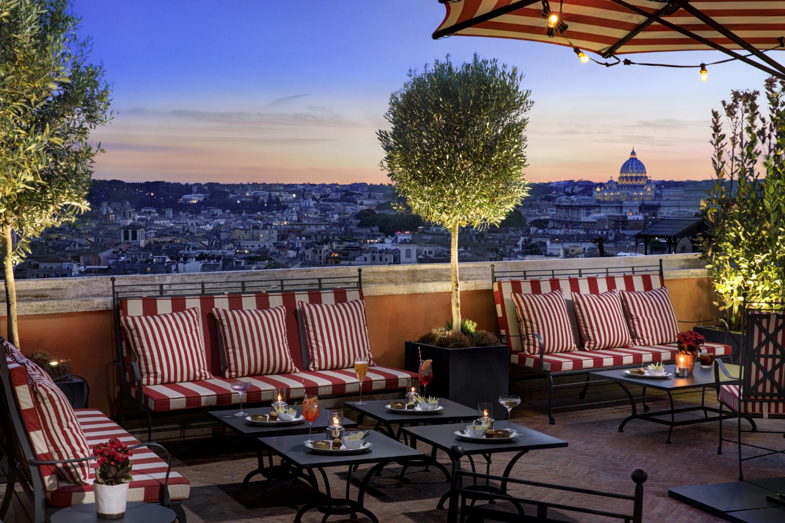 Roof terrace during sunset at Hotel de la Ville in Rome