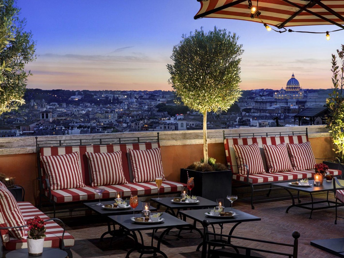 Roof terrace during sunset at Hotel de la Ville in Rome