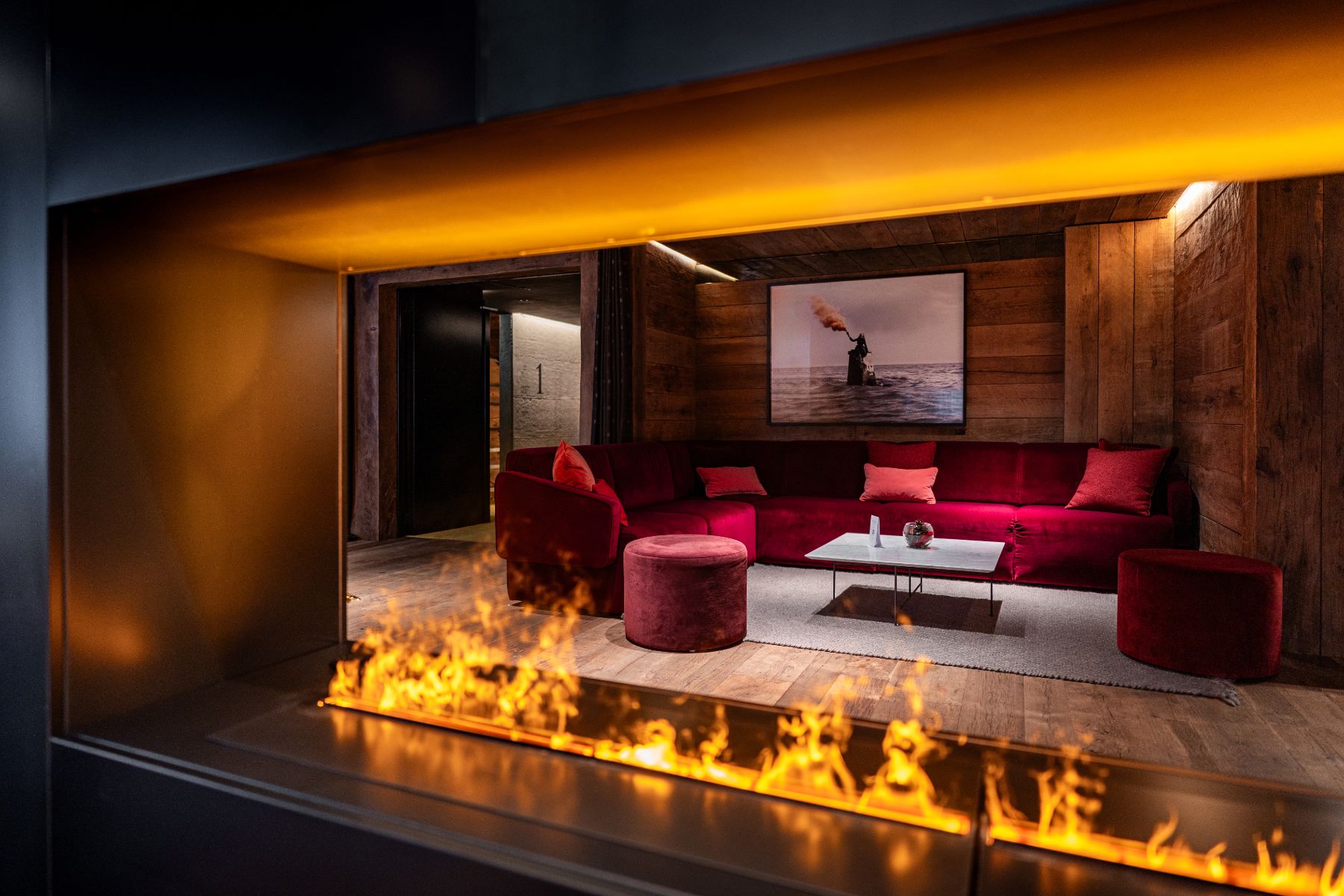 Lounge and fireplace at Hotel de Len in the Dolomites