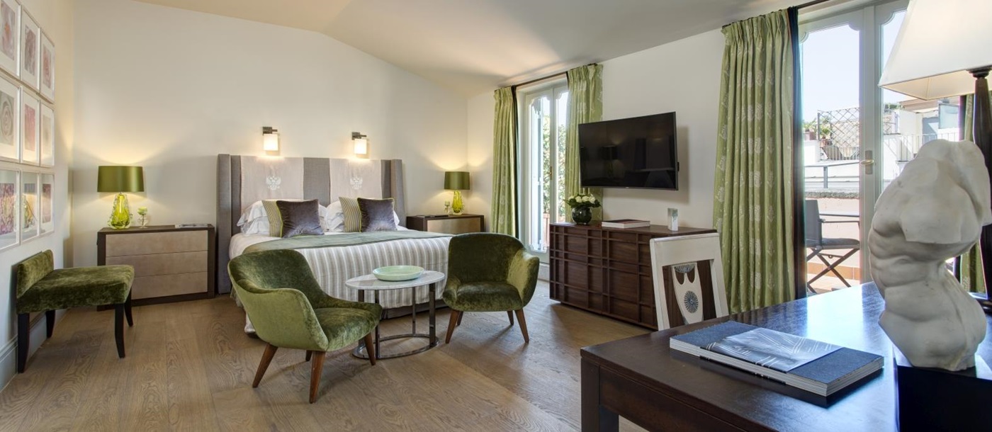 Junior suite with private balcony at Hotel de Russie, luxury hotel in Rome, Italy