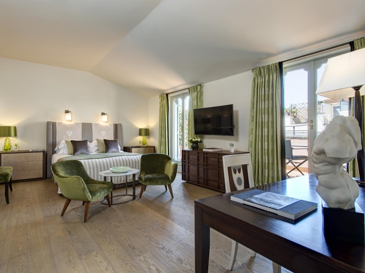 Junior suite with private balcony at Hotel de Russie, luxury hotel in Rome, Italy