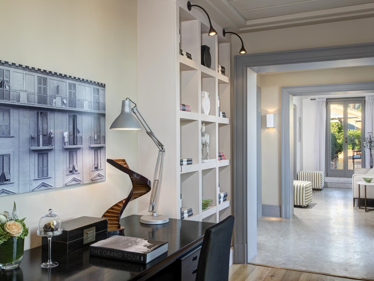 Library in the Nijinsky Suite with desk and art at Hotel de Russie, luxury hotel in Rome, Italy