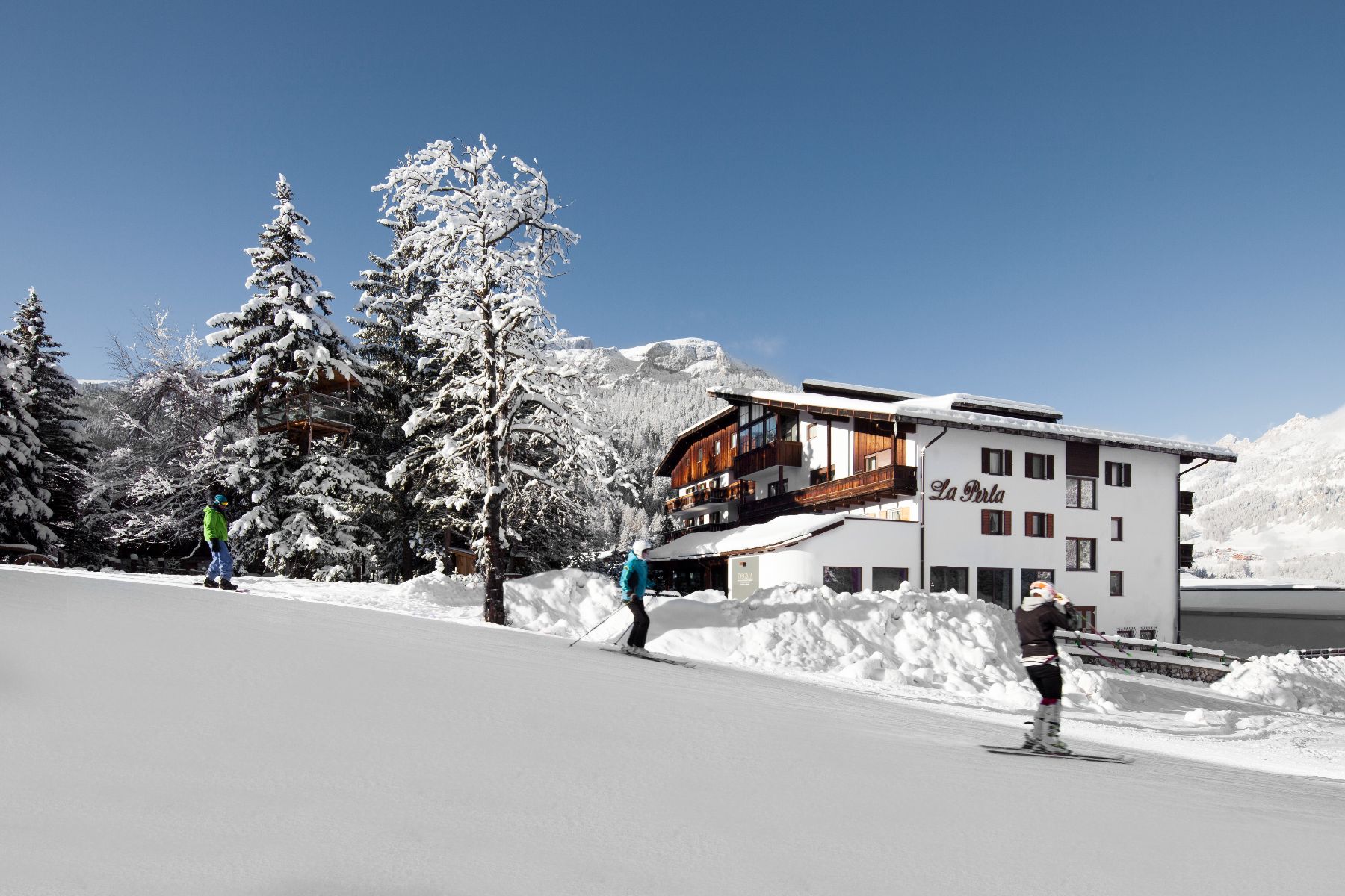 View of Hotel La Perla in Corvara during the winter.