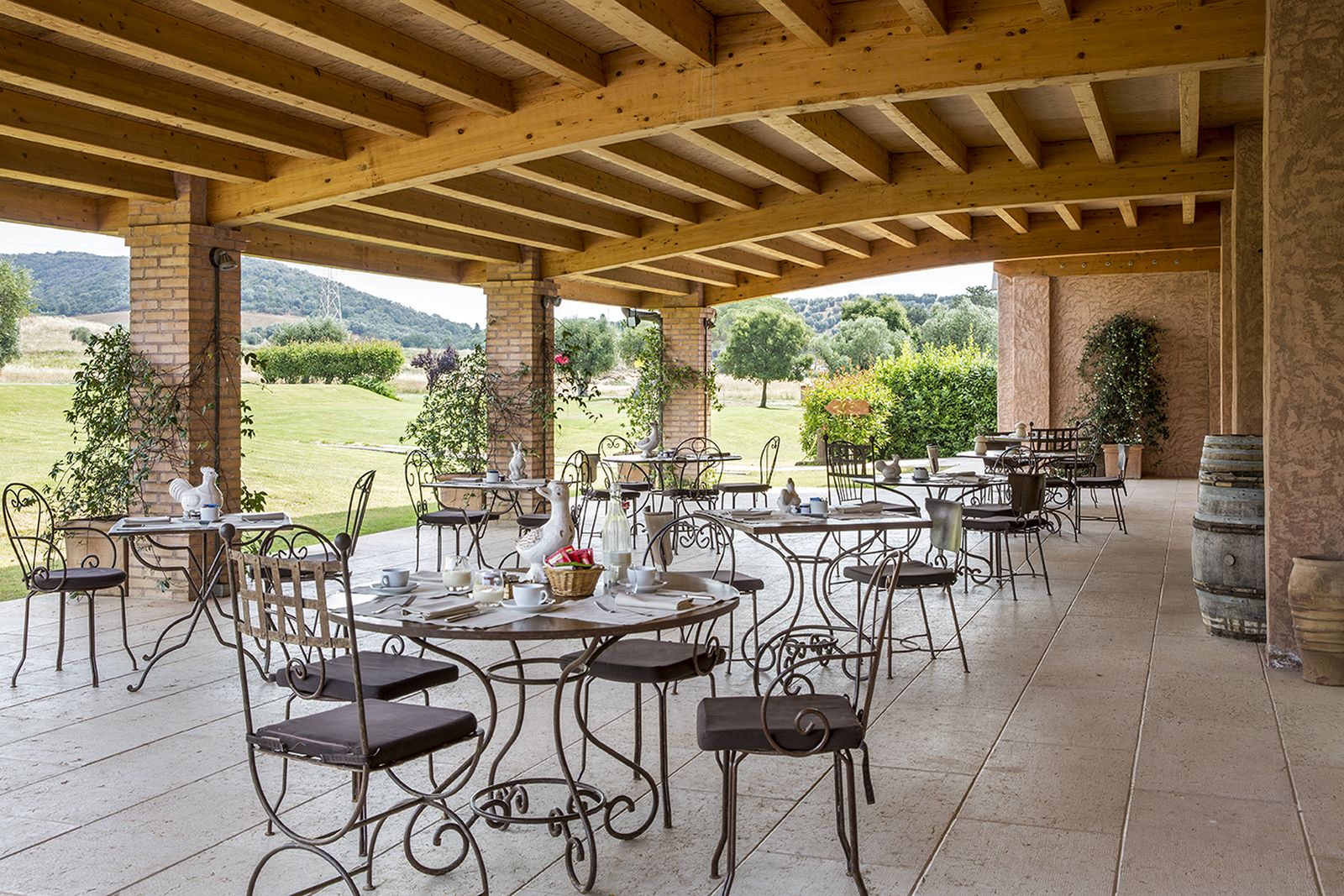 Outdoor dining on the terrace at Hotel L'Andana in Tuscany