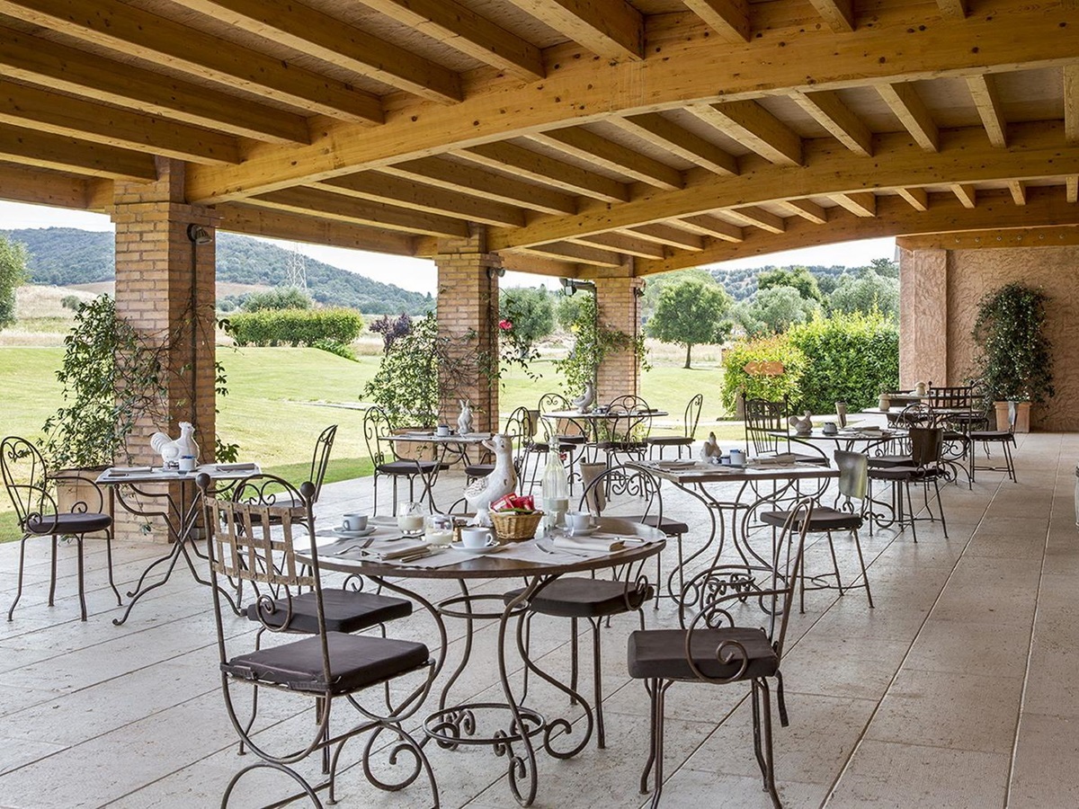 Outdoor dining on the terrace at Hotel L'Andana in Tuscany