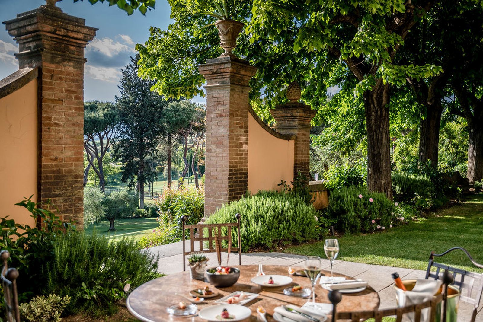 Outdoor dining in the grounds of Hotel L'Andana in Tuscany