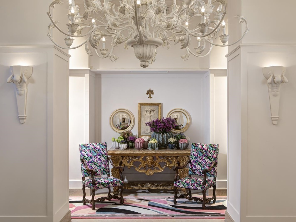 Lobby with chandelier and feature chairs at Hotel Savoy, a luxury hotel in Florence, Italy