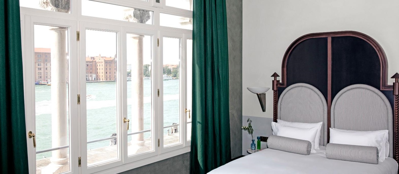 Guest room with views of the canal at Il Palazzo Experimental in Venice