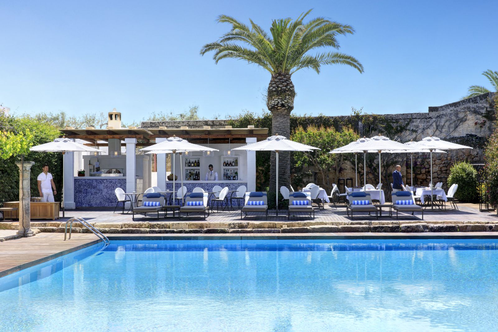 Swimming pool and pool bar at Masseria Torre Maizza in Puglia