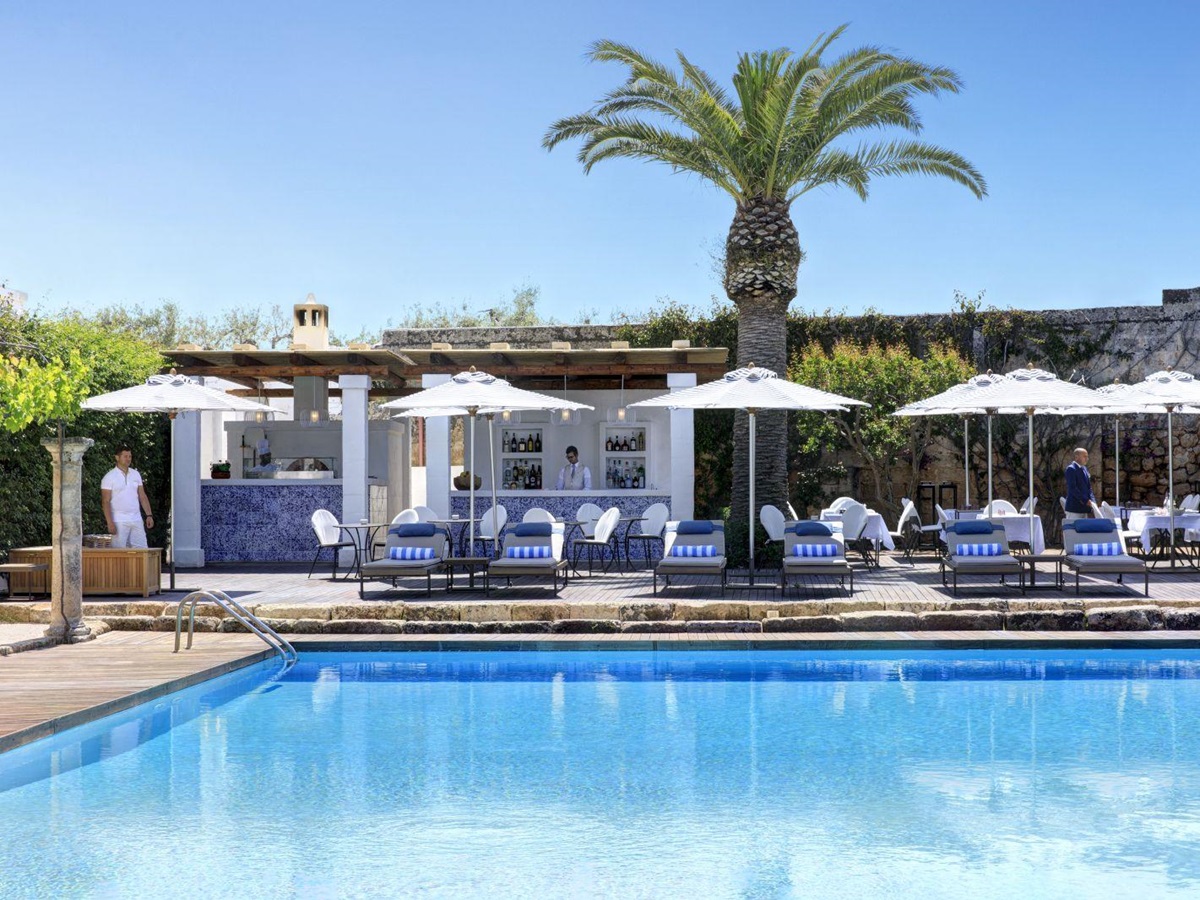Swimming pool and pool bar at Masseria Torre Maizza in Puglia