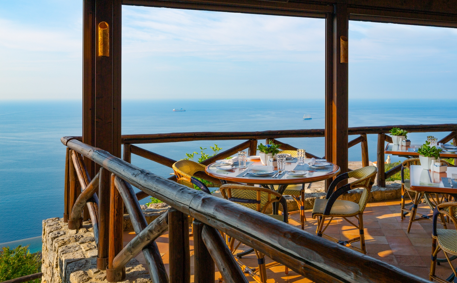 Terrace dining, overlooking the Mediterranean Sea at Monastera Santa Rosa, luxury hotel in Italy